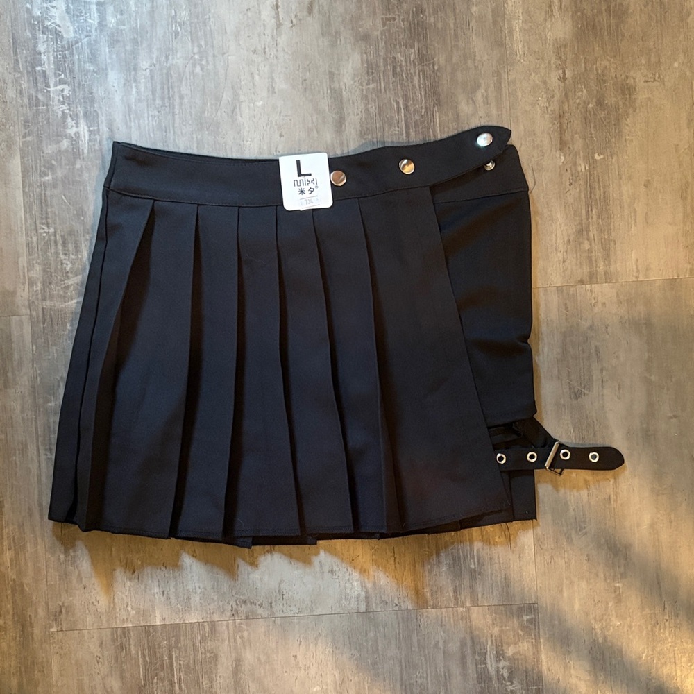 Pleated Black Mini Skirt with Buckle Detail